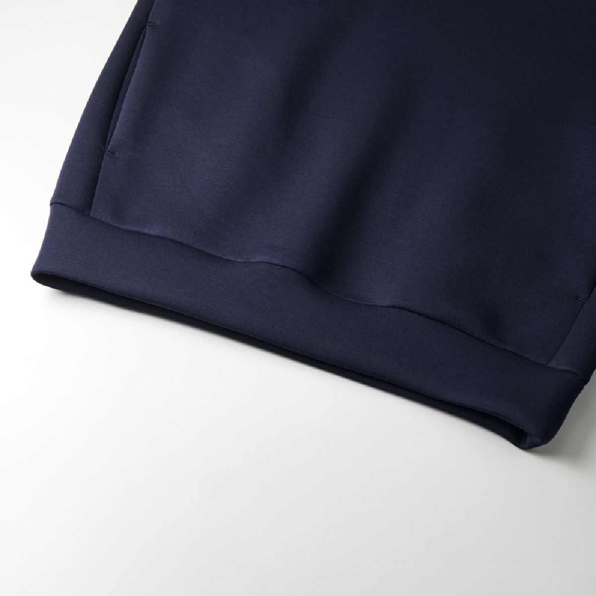 The hem is made of the same fabric as the body.