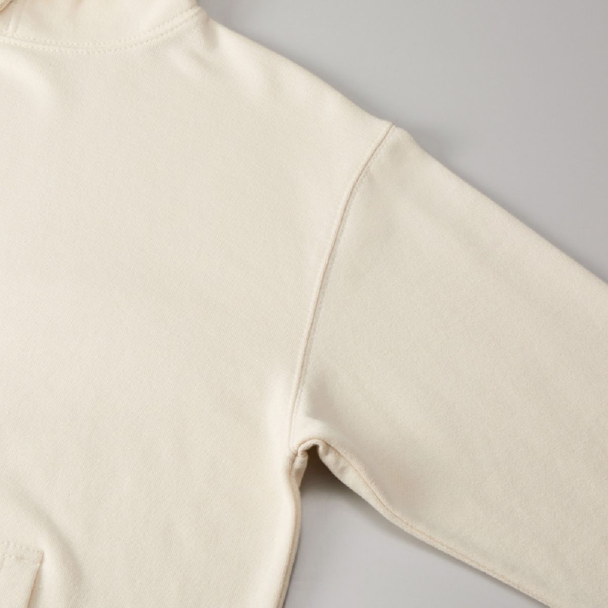 The armholes are sturdy, two-needle needles.