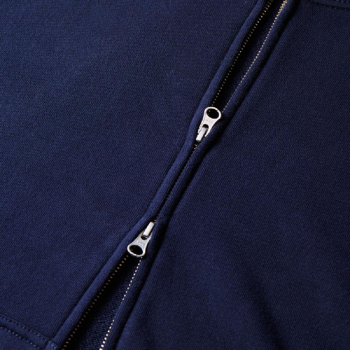 The zipper is hidden, the double slider specification made by YKK, the puller is the DALH type