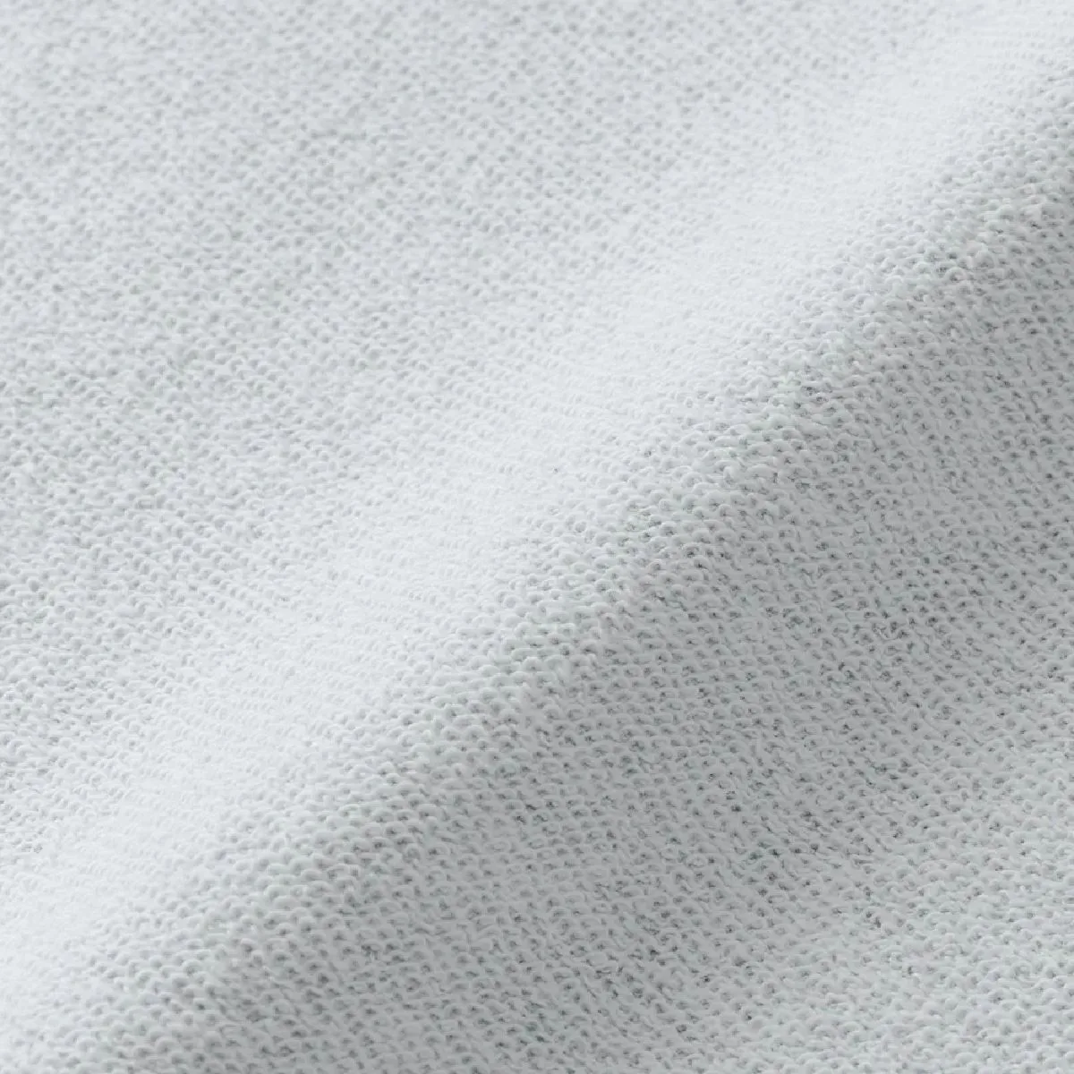 The backside features a backing pile (backing fabric) with elasticity and water absorption.