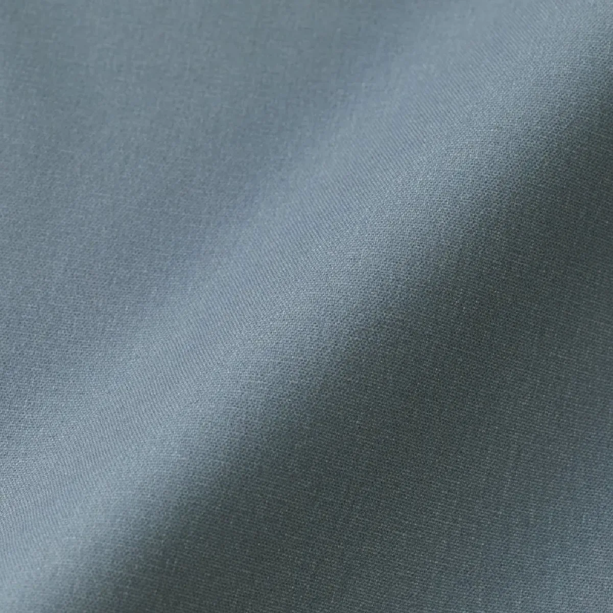 The back side is pressed against the broad fabric.