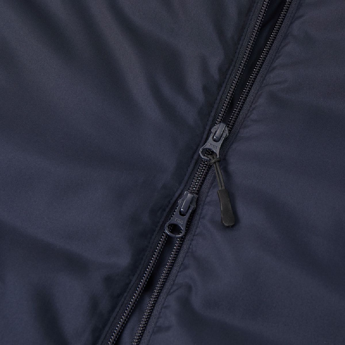 The zipper is a YKK Model DALH with a double-slider configuration and features a pull tab.