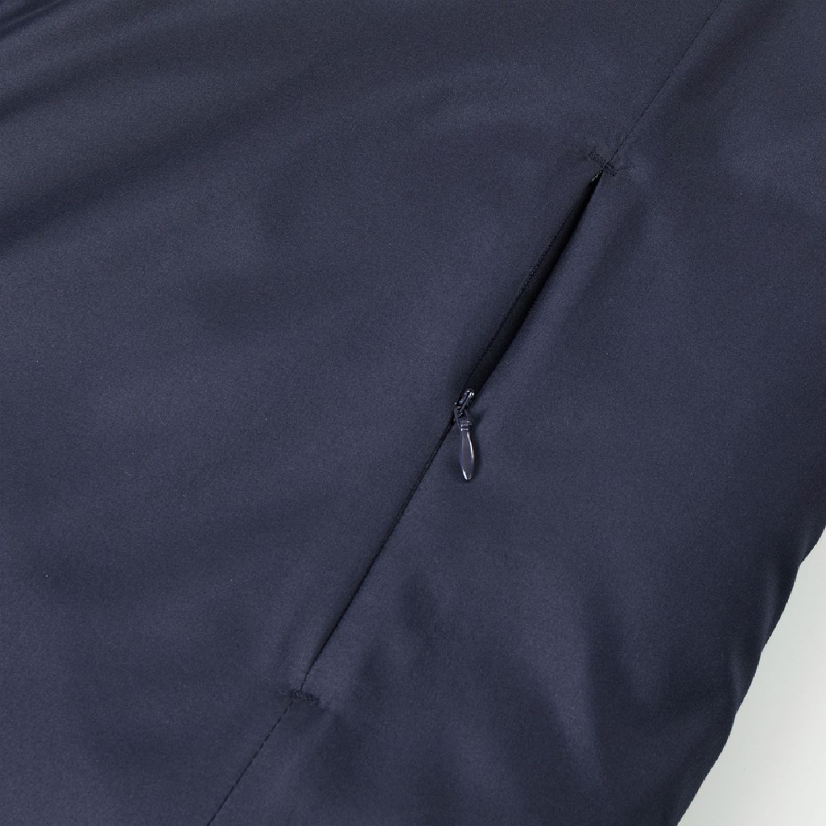 The side pockets feature concealed zippers.