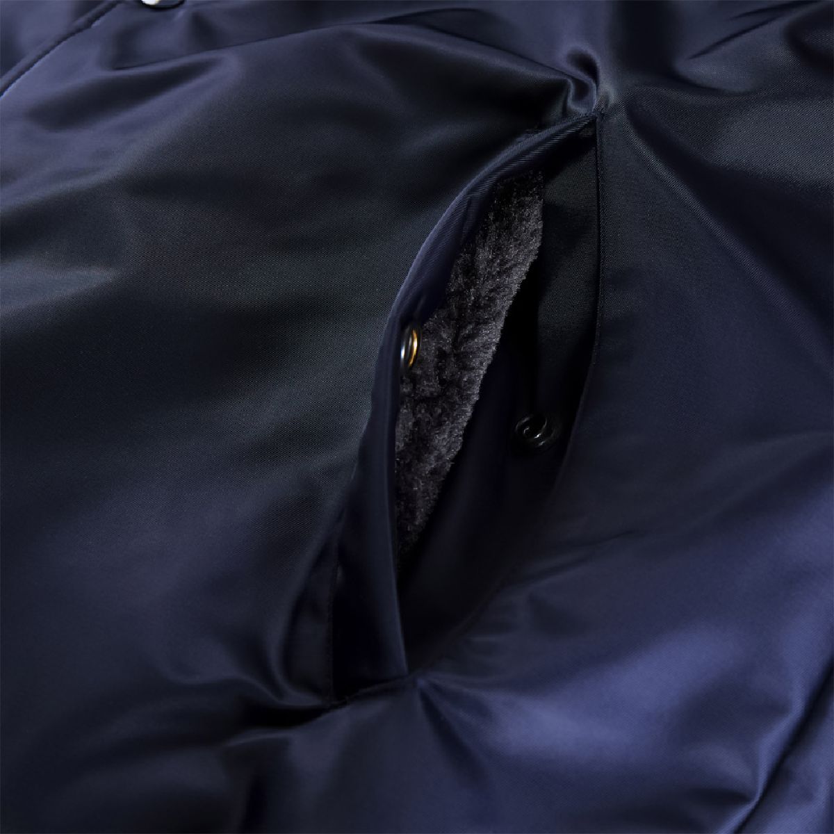 The interior of the pockets features the same boa lining, serving as hand warmers.